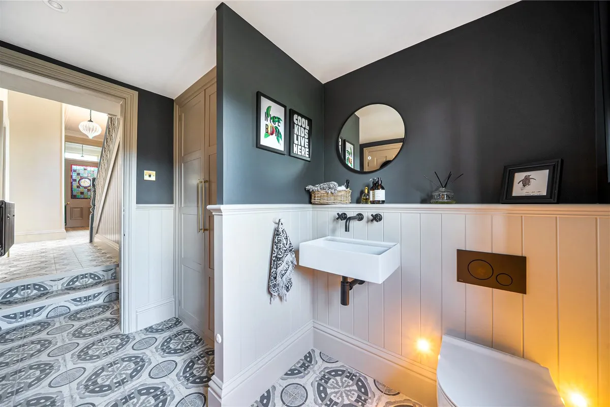 W/C with panelling features and geometric tiles