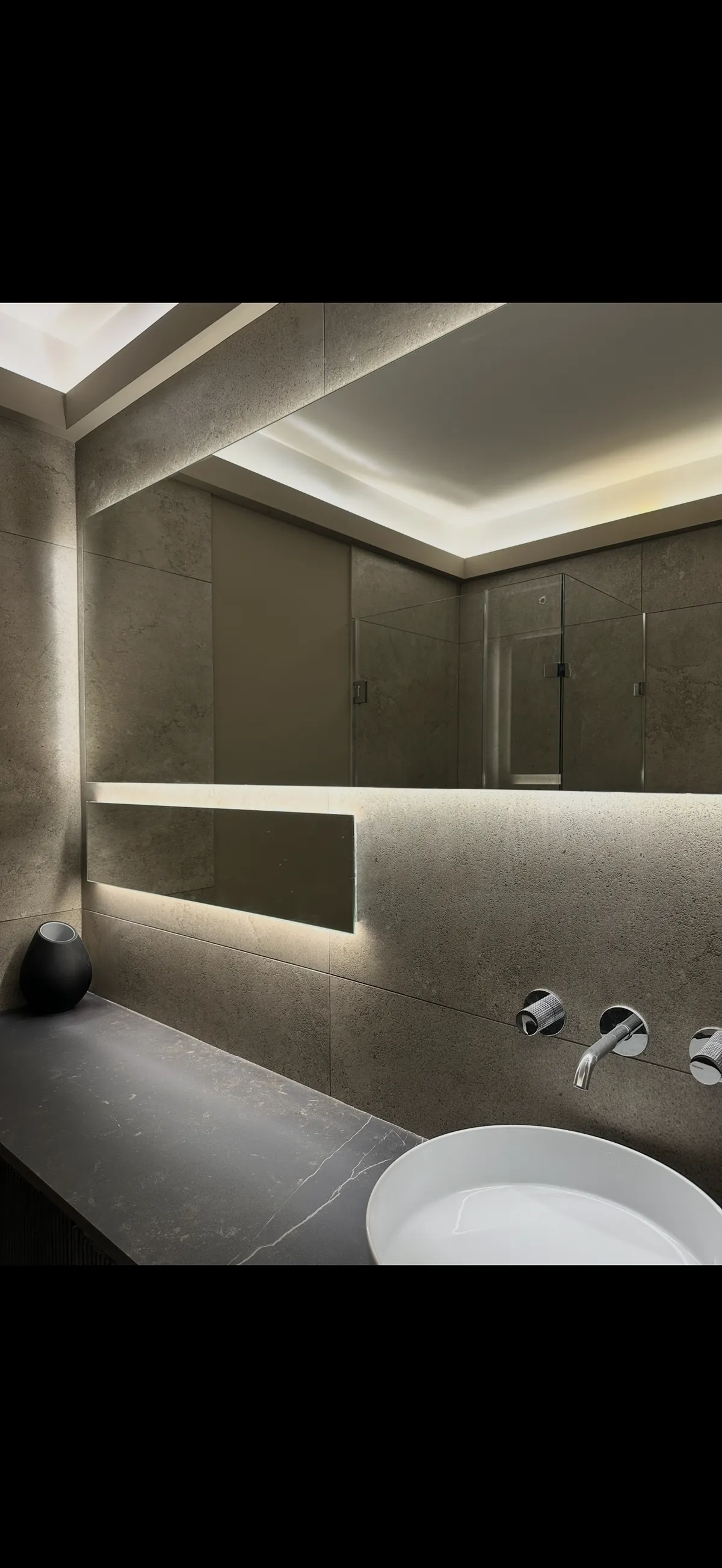 Light up mirrors on tiled wall