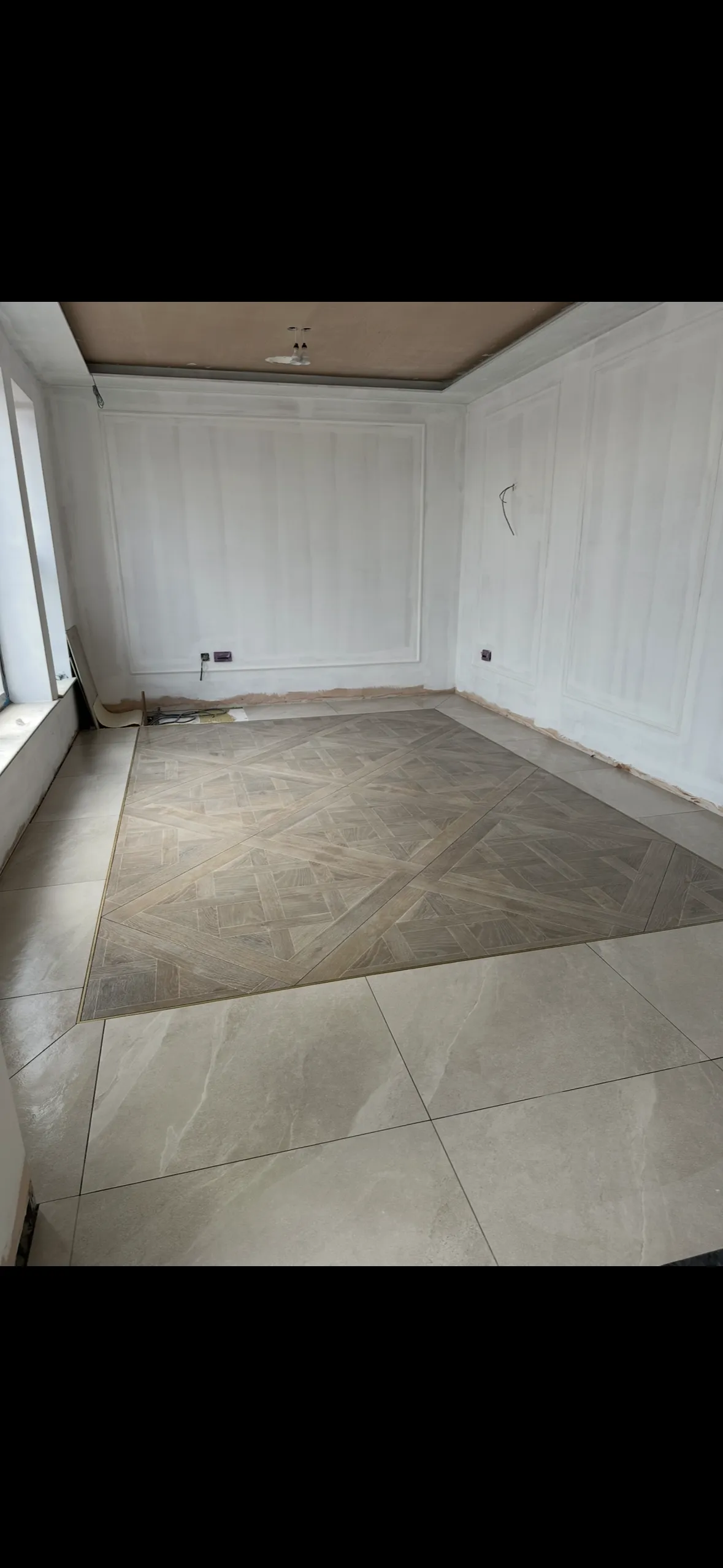 Oak style porcelain tiles with bronze surround in Ilkley