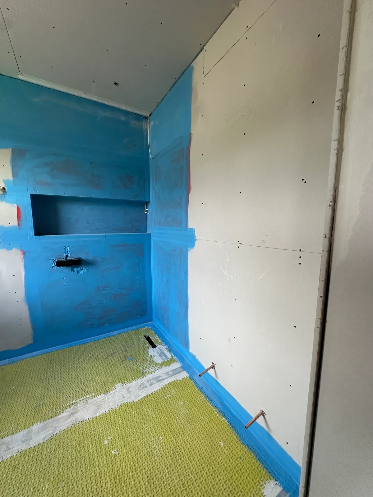 Tanking system in a wet room shower